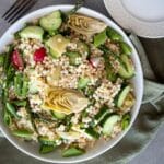 Vegetable couscous salad served up on the table to eat.