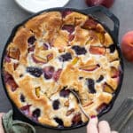 Southern Peach Blackberry Cobbler in a cast iron skillet.