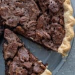 Cut chocolate pecan pie.
