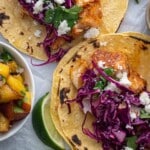 Cod Fish Tacos on a parchment paper.