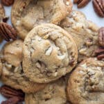 Brown butter pecan cookies stacked in stack.