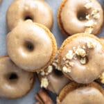 Gingerbread mini donuts with brown sugar glaze on stacked on each other.