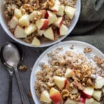 Oat groats cooked in the instant pot and topped with apples, walnuts, and maple syrup.