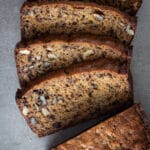 Sliced einkorn banana bread on a surface.