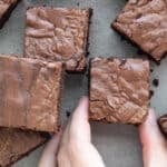 Peanut butter protein brownies cut on a surface.
