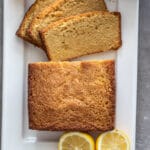 Kamut lemon pound cake sliced on a white platter.