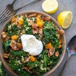 Couscous kale salad in a ceramic bowl with burrata.