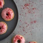 Strawberry mini donuts on a plate.