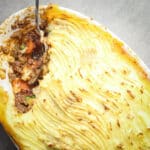 Cottage pie recipe in a white pan.