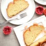 Blood orange and cardamom bundt cake on white plates.