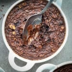 Chocolate baked oatmeal in a white baking dish.