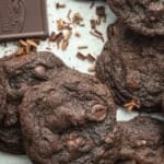 Whole wheat chocolate cookies stacked together.