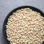 Pearled barley in a steel bowl.