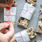 Woman tying baker's twine on homemade granola bars.