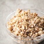 Cooked buckwheat in a glass bowl.
