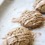 Cinnamon rye scones on a parchment lined baking sheet.