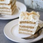 Slice of lemon icebox cake on a white plate.
