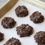 Small batch no-bake cookies on a baking sheet with parchment paper.