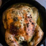 Cooked Herb chicken in a cast iron skillet