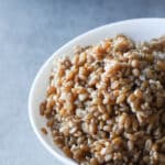 Spelt berries cooked in a white bowl.