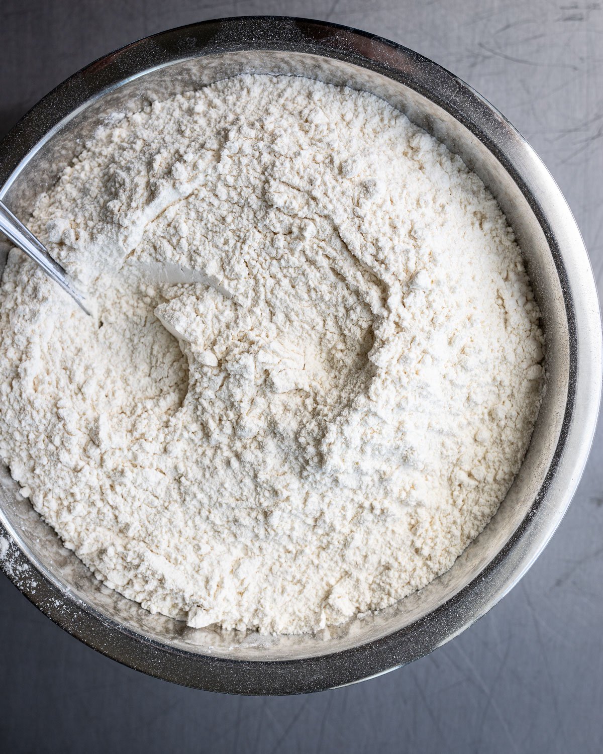 Dry ingredients in a metal bowl for making cookies.