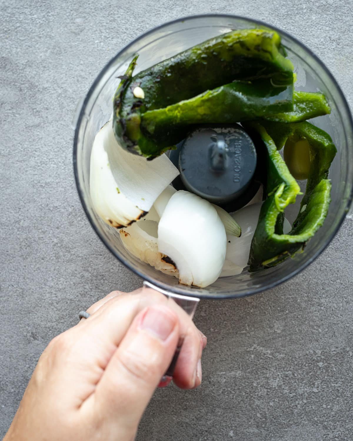 Ingredients for making poblano rice in a small food processor. 