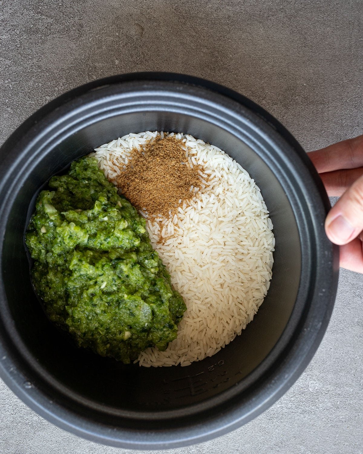 Ingredients in a rice cooker for cooking rice.