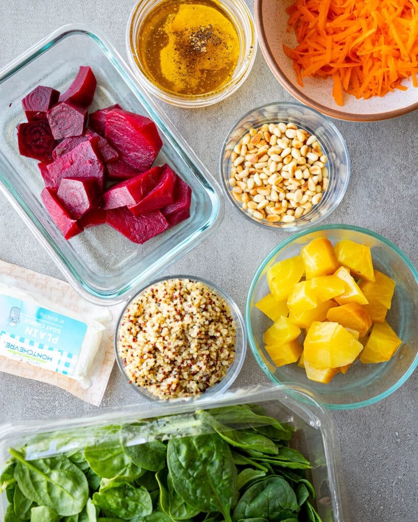 Ingredients for a quinoa salad on a metal surface. 