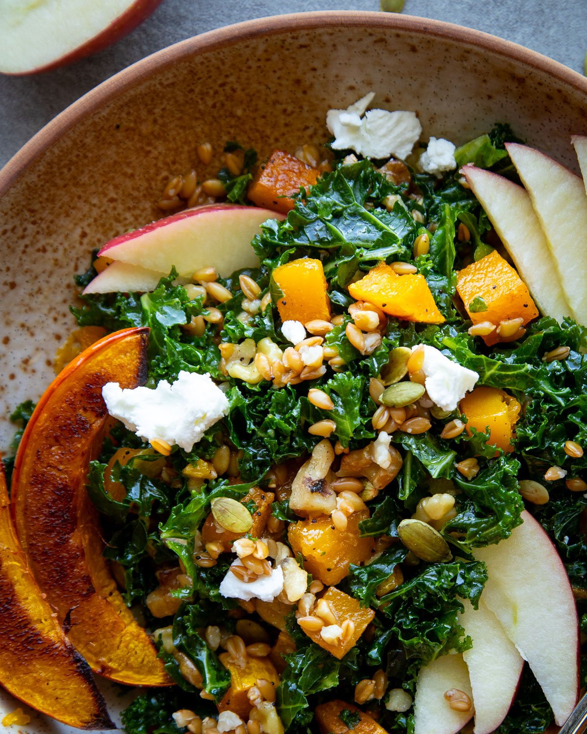 Grain bowl in a ceramic bowl with vegetables.